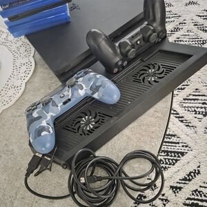 Sony PlayStation Controllers in Black and Blue Camouflage